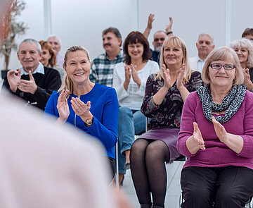 Old people in the seminar event. Many elderly in the conference